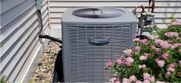Armstrong Air central air conditioner outside a home